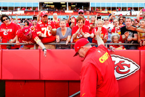 Kansas City Chiefs' head coach Andy Reid waves at the cheering fans of Arrowhead after a 34-7 victory over the St. Louis Rams.