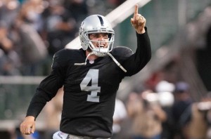Derek Carr will look to utilize a plethora of new offensive weapons in 2015 and prove to his detractors that he is a true franchise quarterback. (Ed Szczepanski-USA TODAY Sports)